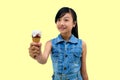 Pretty baby girl kid eating licking banana and strawberry ice cream in waffles cone Royalty Free Stock Photo