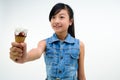 Pretty baby girl kid eating licking banana and strawberry ice cream in waffles cone Royalty Free Stock Photo