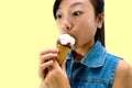 Pretty baby girl kid eating licking banana and strawberry ice cream in waffles cone Royalty Free Stock Photo