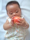 Pretty baby and red apple Royalty Free Stock Photo