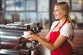 Pretty barista handing a cup of coffee Royalty Free Stock Photo