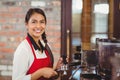 Pretty barista making a cup of coffee Royalty Free Stock Photo