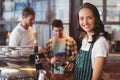 Pretty barista making a cup of coffee Royalty Free Stock Photo