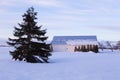 Pretty barn in large rural property seen during a mauve and pink early spring morning