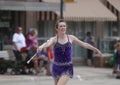 Pretty Baton Twirler in parade in small town America