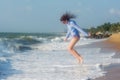 Pretty beautiful young european woman jumping near ocean Royalty Free Stock Photo