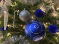 Pretty Big and Small Christmas Ornaments on the Tree Royalty Free Stock Photo