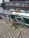 Pretty bike next to a boat