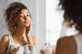 Pretty Black Girl Applying Face Cream Standing In Bathroom, Panorama Royalty Free Stock Photo