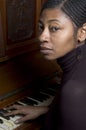 Pretty black woman at piano