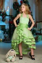 Pretty blond child-girl on the background of a New Year tree Royalty Free Stock Photo