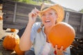 Pretty Blond Female Rancher Wearing Cowboy Hat Hol