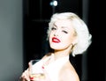 Pretty blond girl model like Marilyn Monroe in red lips. Sensual smiling sexy retro woman. Royalty Free Stock Photo