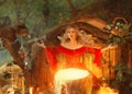 Pretty blond lady above a big magic cauldron with smoke, forest nymph in long bright red dress with loose sleeves cooks