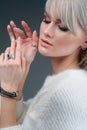 Pretty blond woman in luxury jewelry, lifestyle rich people concept, close up Royalty Free Stock Photo