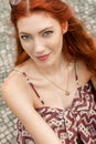 Pretty Blond Woman Sitting on Red Chair Royalty Free Stock Photo