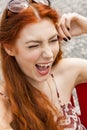 Pretty Blond Woman Sitting on Red Chair Royalty Free Stock Photo