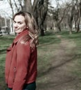 Pretty Blond Woman Smiling, Wearing a Red Jacket Royalty Free Stock Photo