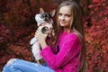 Pretty blonde girl with chihuahua on the nature Royalty Free Stock Photo