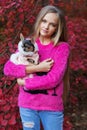 Pretty blonde girl with chihuahua on the nature Royalty Free Stock Photo