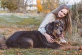 Pretty blonde girl with mastiff on the nature Royalty Free Stock Photo