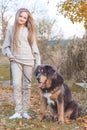 Pretty blonde girl with mastiff on the nature Royalty Free Stock Photo