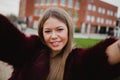 Pretty blonde girl in the park making herself a photo Royalty Free Stock Photo