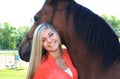 Pretty Blonde High School Senior Girl Outdoor with Horse Royalty Free Stock Photo