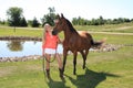 Pretty Blonde High School Senior Girl Outdoor with Horse Royalty Free Stock Photo