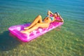 Pretty blonde on inflatable raft Royalty Free Stock Photo