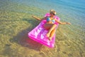 Pretty blonde on inflatable raft Royalty Free Stock Photo