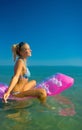 Pretty blonde on inflatable raft Royalty Free Stock Photo