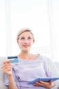 Pretty blonde woman doing online shopping Royalty Free Stock Photo