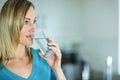 Pretty blonde woman drinking a glass of water Royalty Free Stock Photo