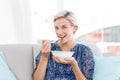 Pretty blonde woman eating bowl of salad Royalty Free Stock Photo