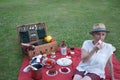 The young woman, dressed in her steward Tartan Bermuda, enjoys meringue for a picnic