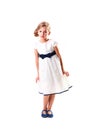Pretty blondie six years old small girl on white background in white prom dress full height Royalty Free Stock Photo
