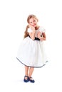 Pretty blondie six years old small girl on white background in white prom dress Royalty Free Stock Photo