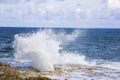 Pretty  blow hole in Grand Cayman Island with sea spray Royalty Free Stock Photo