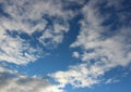 Pretty blue skies after dawn with white puffy clouds opening up for the sunny day ahead