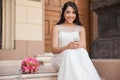 Pretty bride with a cell phone Royalty Free Stock Photo