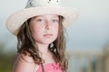 Pretty Brown Haired child with White Hat