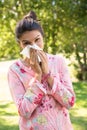 Pretty brunette blowing her nose Royalty Free Stock Photo