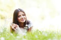 Pretty brunette girl laying on grass Royalty Free Stock Photo