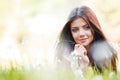 Pretty brunette girl laying on grass Royalty Free Stock Photo