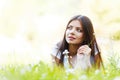 Pretty brunette girl laying on grass Royalty Free Stock Photo