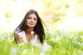 Pretty brunette girl laying on grass Royalty Free Stock Photo