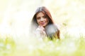 Pretty brunette girl laying on grass Royalty Free Stock Photo