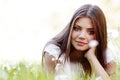 Pretty brunette girl laying on grass Royalty Free Stock Photo