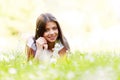 Pretty brunette girl laying on grass Royalty Free Stock Photo